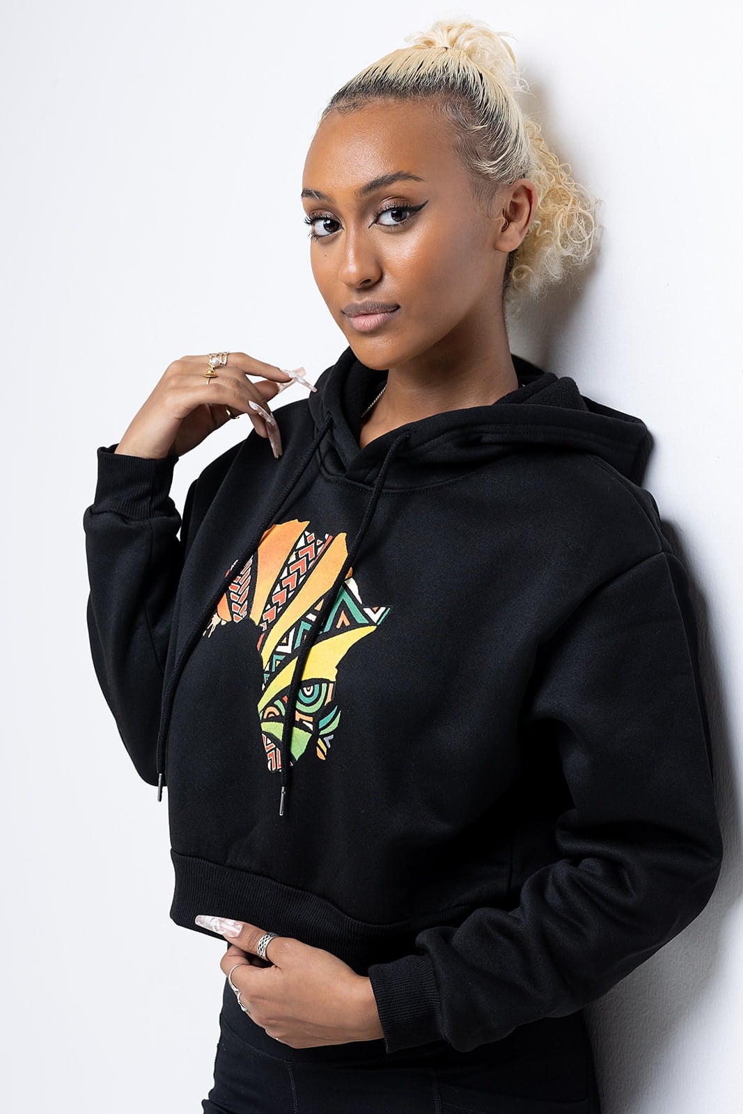 Model wearing a black Droop crop hoodie
