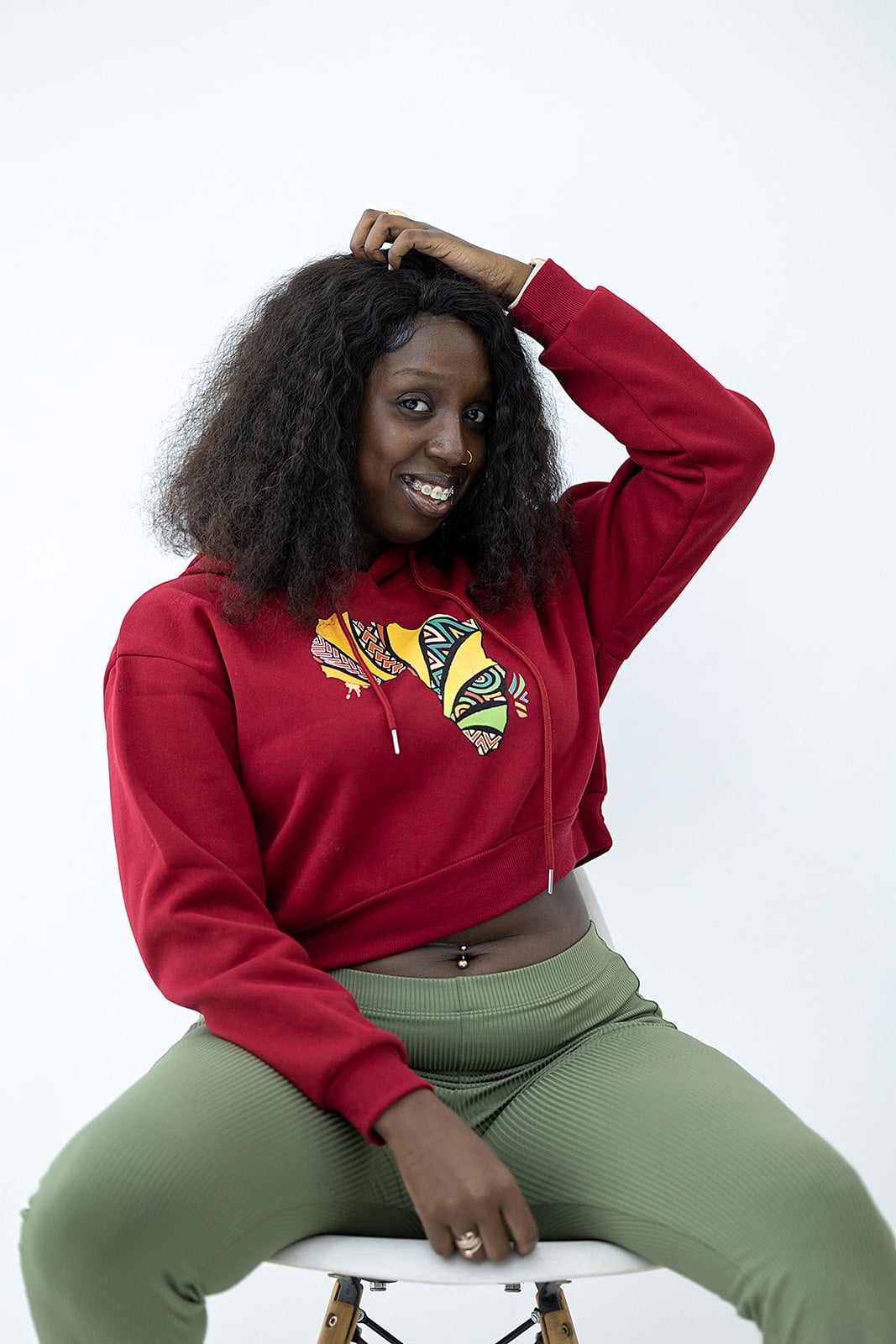 Model wearing a red Droop crop hoodie